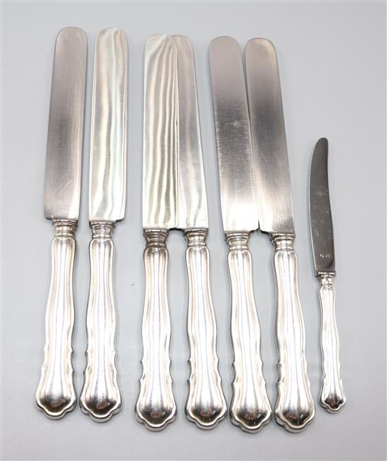 Six German 800 standard silver handled table knives and a cake knife